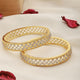 A pair of 2 Gold Dual  Toned AD Studded hand Crafted  Textuerd Bangles