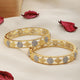 A Pair of 2 Gold Toned Intricate design Bangle Bracelet